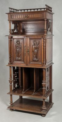 an old wooden cabinet with carvings on the top of it