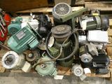 a pile of assorted motor parts on a pallet