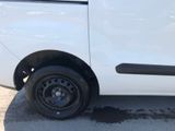 a white van that has a flat tire on it