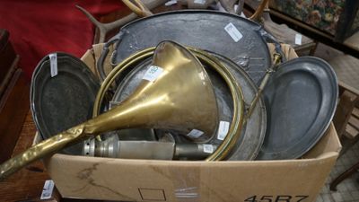 a box full of pots and pans with a brass horn