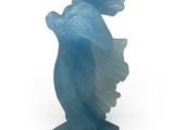 an image of a statue of a woman holding a fish