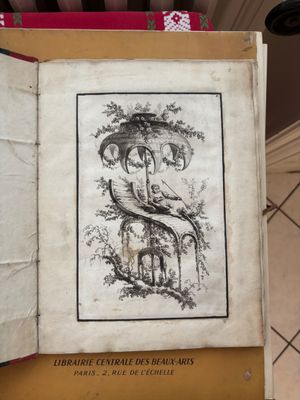 an open book with a drawing of a snake on it