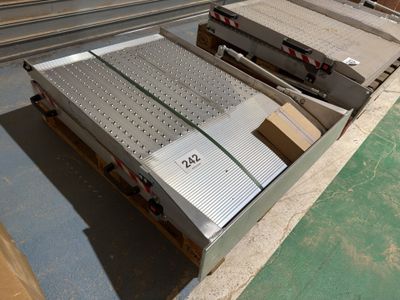 many boxes of metal on a pallet in a warehouse