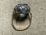 an image of a silver ring with a stone in it