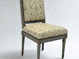 a chair with a floral upholstered seat and a wooden frame