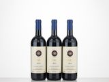 three bottles of wine sitting on top of a table next to each other