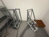 two ladders that are sitting in the corner of a room
