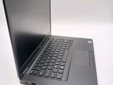 a laptop that is sitting on a white surface