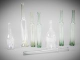 many glass bottles and a pipe in the middle of the picture