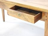 a wooden table with a drawer underneath it