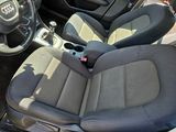 the interior of a car with two seats and a steering wheel
