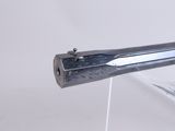 a close up of a metal object on a white surface