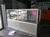 a glass display case in the corner of a store