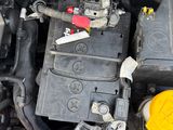 a close up of a car ' s engine with the hood open