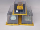 three plastic boxes with a yellow car and a green car