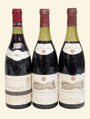 three bottles of wine are lined up in a row on a table