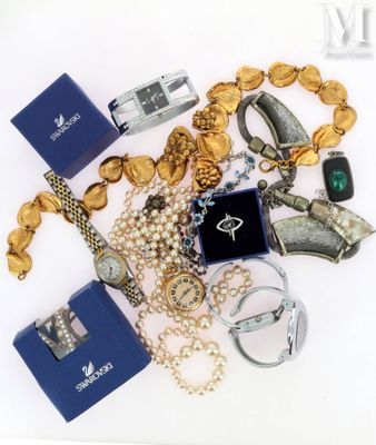 a lot of jewelry that is laying out on the table
