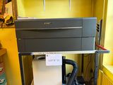 a machine that is sitting on a cart in a room