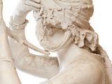 a statue of a woman holding a cell phone to her ear
