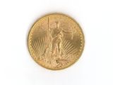 an image of a gold coin on a white surface