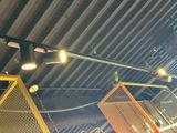 many lights that are hanging from the ceiling of a building