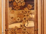 a wooden door with a painting of flowers on it