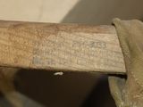 a close up of a baseball bat with a glove on it
