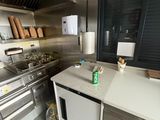 a kitchen with stainless steel appliances and a counter top