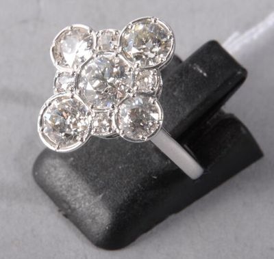 an image of a close up of a diamond ring on a rock