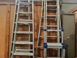two ladders that are standing next to each other
