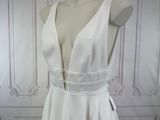 a picture of a white dress on a mannequin