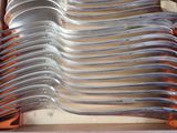 a lot of spoons that are sitting in a box