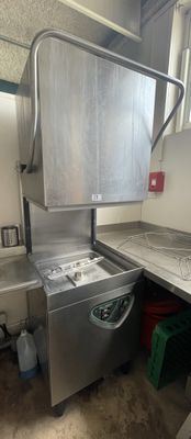 an image of a kitchen with a washer and dryer