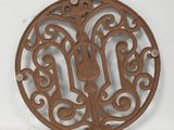 an image of a decorative iron plate with a bird on it