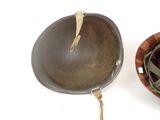two pans sitting next to each other on a table
