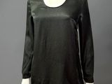 a mannequin mannequin wearing a black top and black skirt