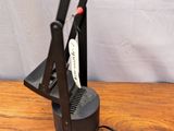 an image of a desk lamp on a wooden table