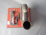a small metal object with a pipe attached to it