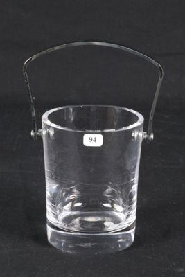 a clear glass with a handle on a black background