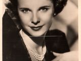 black and white photo of a woman with a pearl necklace and pearls