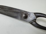 a close up of a pair of scissors on a table