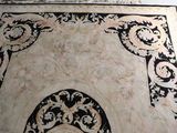 a black and white rug with a design on it