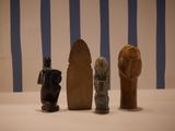 three figurines that are sitting on a table