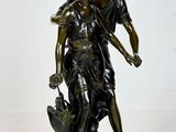 bronze statue of a man and woman holding a dog on a white background
