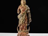 an image of a statue of jesus holding a cross on a table
