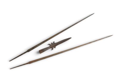 two wooden chopsticks and a knife on a white surface