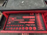 a red tool box with tools inside of it