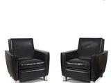 pair of black leather club chairs with chrome legs