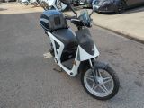 a motorcycle that is parked on the side of the street