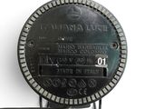 a close up of a clock on a white wall